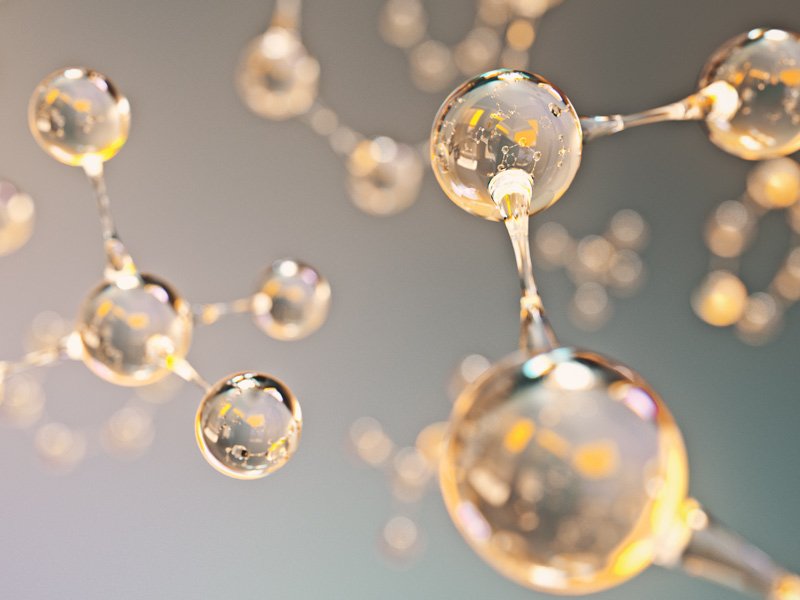 Life Extension, shiny, transparent, and golden molecules on a light gray background